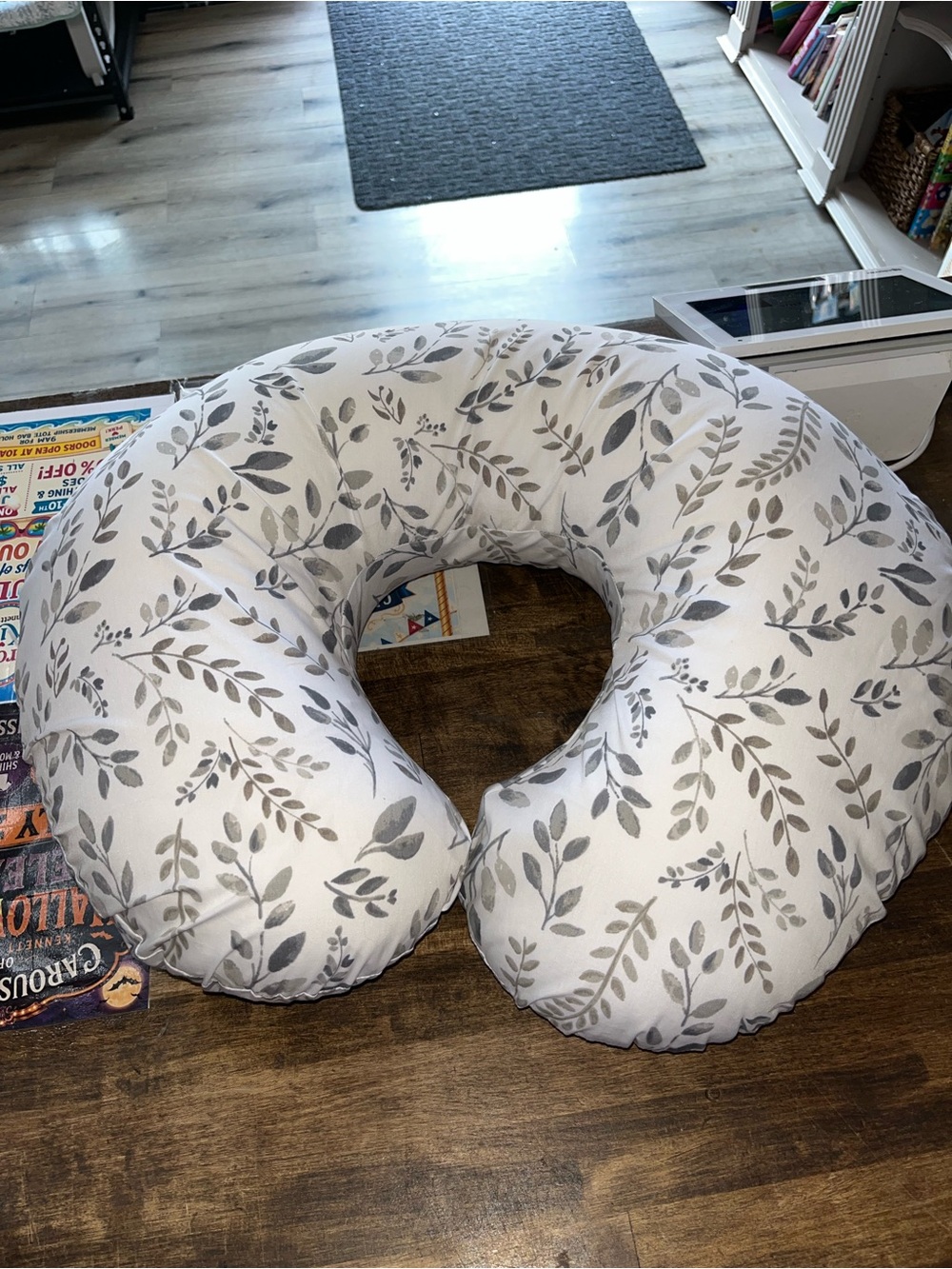 Boppy brand nursing and infant support pillow.